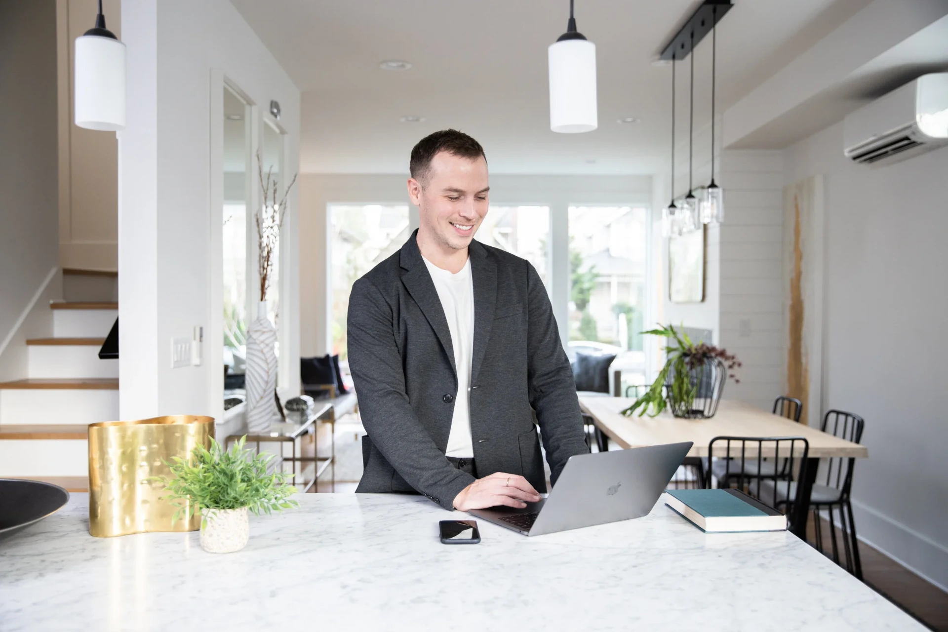 Wesley Gardner working at a marble kitchen island